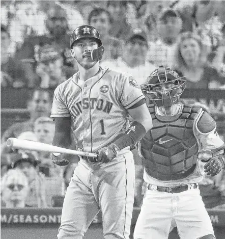  ?? Michael Ciaglo / Houston Chronicle ?? Carlos Correa stops to briefly admire his solo home run in the 10th inning that gave the Astros a 5-3 lead over the Dodgers in Game 2 of the World Series on Wednesday night in Los Angeles.