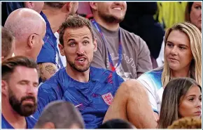  ?? ?? Harry Kane chats with family members in the stand after the Wales win