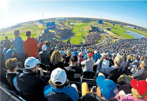  ??  ?? Bird’s-eye view: Players can fall apart under the pressure on the first tee, watched by the noisy fans in the biggest golf stand ever