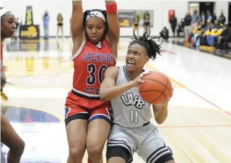  ?? (Special to the Commercial/William Harvey) ?? UAPB senior Tia Morgan stands in the post while guarded by Jackson State sophomore Hayleigh Breland during a Feb. 12 women’s basketball game at H.O. Clemmons Arena in Pine Bluff.