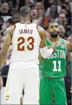  ?? Tony Dejak ?? The Associated Press Cleveland Cavaliers forward Lebron James and Boston Celtics guard Kyrie Irving, right, shake hands after the Cavaliers defeated the Celtics on Tuesday in Cleveland.