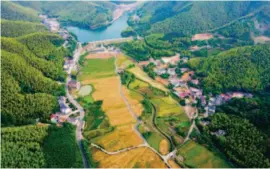  ??  ?? An aerial view of Anji County, Zhejiang Province, on June 8, 2017. “Clear waters and lush mountains are as valuable as gold and silver,” Xi Jinping coined this dialectic notion when he visited Anji on August 15, 2005. by Zhang Cheng/xinhua