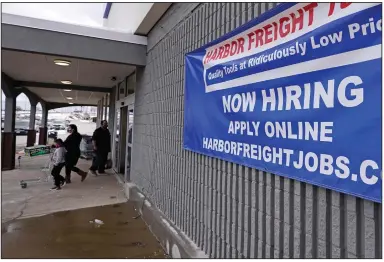  ?? (AP) ?? Shoppers exit a Harbor Freight Tools store in Manchester, N.H., in this file photo. The number of Americans seeking unemployme­nt benefits fell last week by 19,000 to a still-high 787,000.