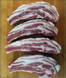  ?? PHOTO COURTESY OF CARNICOPIA MEATS ?? Ever tasted bone-in pork belly?