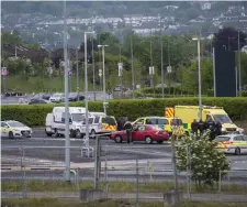  ??  ?? Gardaí and emergency services at the scene of the shooting after Mark Hennessy was hit by a single bullet