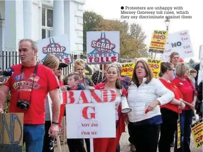  ??  ?? Protesters are unhappy with Mersey Gateway toll rules, which they say discrimina­te against them