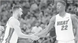  ?? JOHN MCCALL/SOUTH FLORIDA SUN SENTINEL ?? Miami Heat’s Jimmy Butler, right, and Max Strus have a uniquely endearing relationsh­ip.