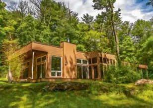  ?? ?? LEFT The home sits on nearly 2 acres near the Housatonic River.