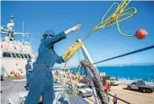  ?? PETTY OFFICER 2ND CLASS DANIELLE BAKER U.S. NAVY ?? Sailors work aboard the littoral combat ship Milwaukee at Naval Station Guantanamo Bay.