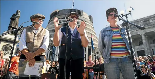  ?? ROBERT KITCHIN/STUFF ?? RNZ Concert should stay forever, according to The Topp Twins, MCs for yesterday’s rally at Parliament, alongside Wellington Paranormal’s Karen O’Leary. ‘‘If we lose things like this, then we lose the arts,’’ O’Leary told the station’s supporters.