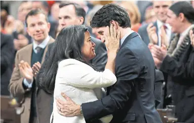  ?? JUSTIN TANG THE CANADIAN PRESS FILE PHOTO ?? How times have changed in one year. In this photo from Feb. 14, 2018, then-attorney general Jody Wilson-Raybould embraces Prime Minister Justin Trudeau in the House of Commons in Ottawa. On Tuesday, she resigned from cabinet.