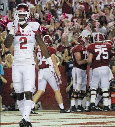  ?? Arkansas Democrat-Gazette/BENJAMIN KRAIN ?? Arkansas defensive back Kamren Curl walks off the field as Alabama celebrates a touchdown during the first quarter of the Razorbacks’ game in Tuscaloosa, Ala., on Saturday night. The No. 1-ranked Crimson Tide built a 17-0 lead and coasted the rest of...