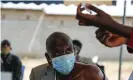  ?? Photograph: Brian Inganga/AP ?? A man receives a dose of the AstraZenec­a vaccine in Kimana, Kenya.