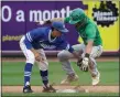  ?? DAVID C. TURBEN — FOR THE NEWS-HERALD ?? Gilmour shortstop Ben DeMell tags out Chaminade Julienne’s Dylan Snyder during the 2019 Division II state final in Akron.