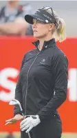  ?? Picture: GETTY ?? Madelene Sagstrom watches her shot on the 18th Beach course hole yesterday.