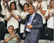  ?? Arkansas Democrat-Gazette/MITCHELL PE MASILUN ?? Ernest G. Green gestures to the audience as fellow Little Rock Nine member Gloria Ray Karlmark (left) applauds after Green’s remarks Monday during the commemorat­ion ceremony.