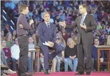  ?? South Florida Sun-Sentinel photo ?? WANTING ANSWERS: Marjory Stoneman Douglas High School student Cameron Kasky, left, asks Sen. Marco Rubio, right, a question during a Feb. 21 CNN town hall meeting in Sunrise, Fla.