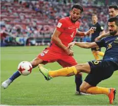  ?? Reuters ?? Australia’s Aziz Behich fights for the ball with Chile’s Mauricio Isla in a Group B match at the Spartak Stadium, Moscow.