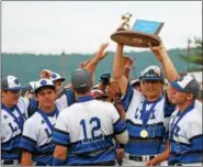  ?? AUSTIN HERTZOG - DIGITAL FIRST MEDIA ?? Oley Valley’s Gray Williamson raises the District 3-AA championsh­ip trophy on June 2.