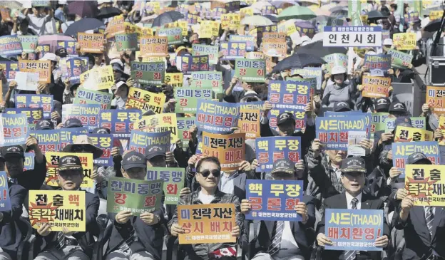  ??  ?? 0 Members of the Korean Veterans Associatio­n at a rally denouncing North Korea’s nuclear and missile provocatio­n in Seoul, South Korea