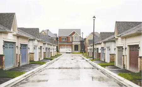  ?? COLE BURSTON/BLOOMBERG FILES ?? Inflation in housing prices has spread from the Greater Toronto Area, above, to markets such as Moncton, N.B., Ottawa and Halifax, according to CMHC. Kevin Carmichael writes that Canada is long overdue for a major rethink of housing policy.