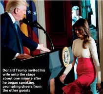  ??  ?? Donald Trump invited his wife onto the stage about one minute after he began speaking, prompting cheers from the other guests