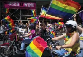  ?? THE ASSOCIATED PRESS ?? Members of the Siren Motorcycle club participat­e in the New York City Pride Parade on Sunday in New York.