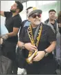  ?? / Associated Press ?? Soccer legend Diego Maradona walks through the airport in Culiacan, Mexico, Saturday.