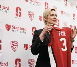  ?? PHOTOS BY DAI SUGANO — BAY AREA NEWS GROUP ?? New Stanford women's basketball head coach Kate Paye holds a jersey that was given to her Wednesday.