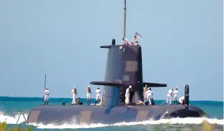  ??  ?? THE Collins-class submarine HMAS Waller. Australia plans to replace the Collins class submarine with a new fleet of nuclear attack submarines with assistance from the UK and US.