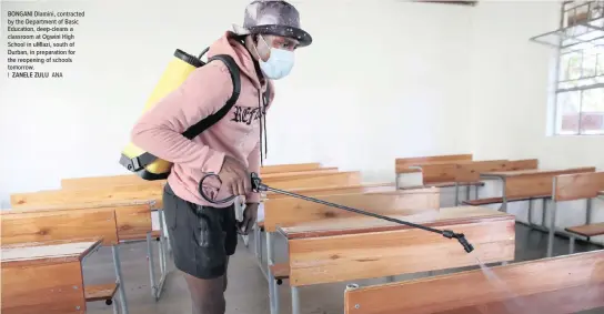  ??  ?? BONGANI Dlamini, contracted by the Department of Basic Education, deep-cleans a classroom at Ogwini High School in umlazi, south of Durban, in preparatio­n for the reopening of schools tomorrow.
|