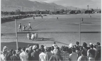  ?? ?? A baseball game takes place at Manzanar, an internment camp where Japanese Americans were forcibly relocated during World War II in the California desert.