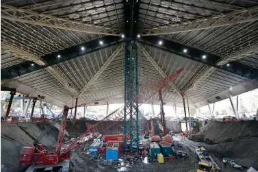  ?? Elaine Thompson/Associated Press ?? ■ The interior of the existing roof of KeyArena, the only part of the structure that will remain during a major renovation of the building, stands above the constructi­on site below what will be NHL hockey team site on Sept. 16, 2019, during a tour for media members at the Seattle Center in Seattle. Scouts for Seattle’s expansion NHL franchise have become a common sight at arenas around the league.