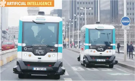  ?? — Reuters ?? Two self-driving electric minibuses are seen on the 130-metre test route between Gare de Lyon and Austerlitz train stations, the first regular line opened by the Paris transport company RATP, in Paris.