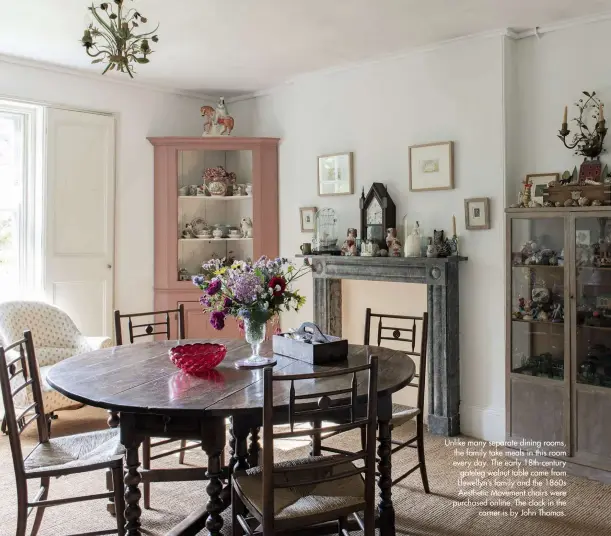  ??  ?? Unlike many separate dining rooms, the family take meals in this room every day. The early 18th-century gateleg walnut table came from Llewellyn’s family and the 1860s Aesthetic Movement chairs were purchased online. The clock in the corner is by John Thomas.