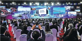  ?? REN CHAO / XINHUA ?? Participan­ts at the opening ceremony of the 2021 Zhongguanc­un Forum, which highlights the applicatio­n of new technologi­es, products and materials.