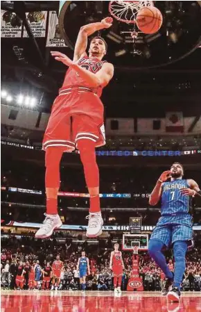  ?? EPA PIC ?? Bulls’ Zach LaVine scores in the game against Magic in Chicago on Monday.