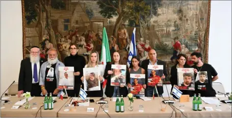  ?? PHOTO BY ALBERTO PIZZOLI/AFP VIA GETTY IMAGES ?? Relatives of Israeli hostages Omri Miran, Agam Berger, Guy Gilboa Dalal, Tamir Nimrodi and Bibas family members (Shiri, Yarden, Ariel, Kfir), held in Gaza since October 7attacks by Hamas militants, give a press conference on Monday in Rome.