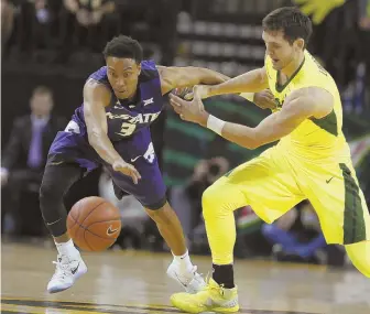  ?? AP PHOTO ?? GRAND THEFT: Kansas State guard Kamau Stokes, left, steals the ball from Baylor guard Jake Lindsey yesterday in Waco, Texas.