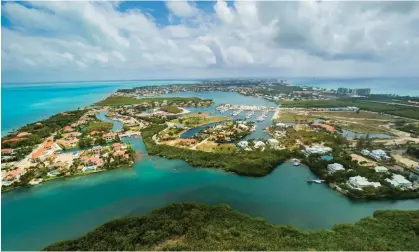  ?? ?? Grand Cayman, looking north with West Bay in the distance. Photograph: Westend61/Getty Images