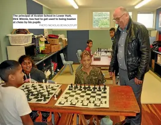  ?? PHOTO: NICHOLAS BOYACK/STUFF ?? The principal of Avalon School in Lower Hutt, Dirk Winnie, has had to get used to being beaten at chess by his pupils.