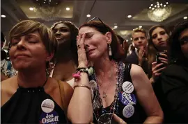  ?? DAVID GOLDMAN/ASSOCIATED PRESS ?? Jan Yanes, center, cries as Democratic candidate Jon Ossoff concedes to Republican Karen Handel in the race for the 6th Congressio­nal District seat in Georgia.