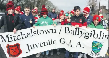  ?? (Pic: Sean Burke) ?? Thumbs up from members of Mitchelsto­wn/Ballygibli­n Juvenile GAA Club, marching in last Friday’s parade in ‘Town.