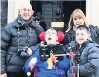  ??  ?? Zack Kerr and his family deliver the petition to Downing Street