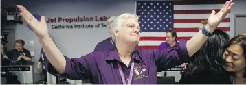  ?? JAE C. HONG / AGENCE FRANCE-PRESSE / GETTY IMAGES ?? Cassini Spacecraft Operations Team Manager Julie Webster reacts after confirmati­on of Cassini’s demise.