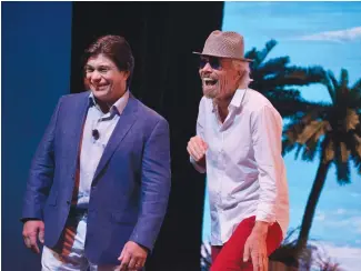  ??  ?? Opposite page: Tom McAlpin with Bain Capital managing director Stephen Pagliuca (left), at the first ship’s steel-cutting ceremony; Below: McAlpin and Richard Branson at a media event in Miami