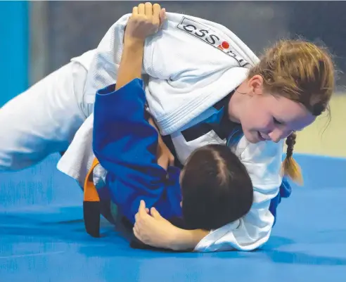  ??  ?? GOOD FORM: Redlynch State College Year 8 student Amy Cooper has partial sight but will compete in a national judo competitio­n.