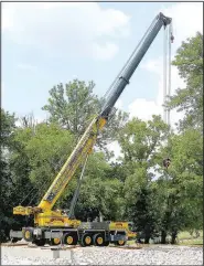  ?? (NWA Democrat-Gazette/Randy Moll) ?? A large crane was in place on the north side of Flint Creek on Monday to place bridge supports.