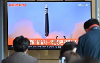  ?? AFP/ VNA Photo ?? People watch a television
screen showing a news broadcast with file footage of a North Korean missile
test, at a railway station in Seoul yesterday. North Korea fired a ballistic missile
yesterday, South Korea’s military said, just a week after leader Kim Jong-un vowed to boost Pyongyang’s
nuclear arsenal at the “fastest possible speed”.