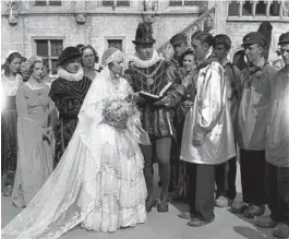  ?? CHICAGO TRIBUNE HISTORICAL PHOTO ?? Bride and groom Marie De Maesschale­k and Joseph Sophie are married by the village registrar Jacques Sandeel in the Belgian Village at A Century of Progress World’s Fair in Chicago, circa June 1934.